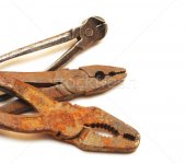 963335_stock-photo-old-rusty-pliers-on-a-plain-white-background.jpg